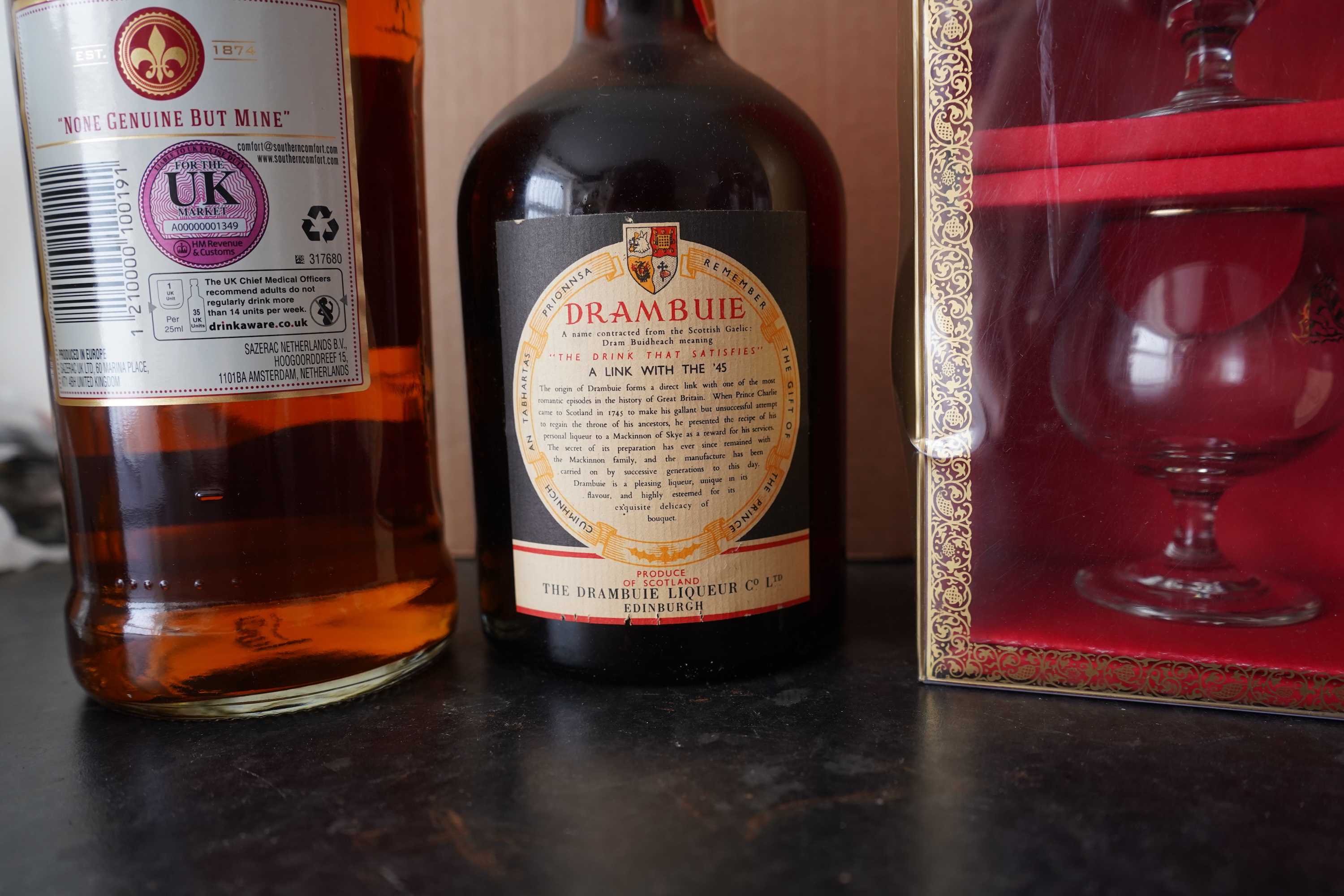 Six bottles of spirits and liqueurs, including whiskey and gin